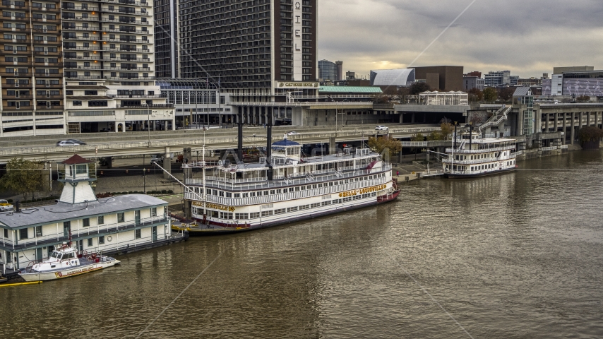 Historic riverboat docked by Downtown Louisville, Kentucky Aerial Stock Photo DXP001_095_0016 | Axiom Images