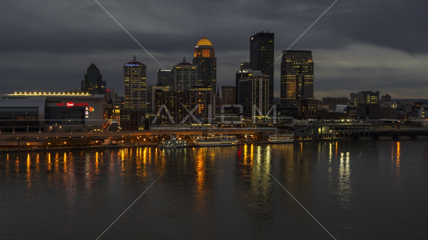 A view of the skyline lit up at twilight, seen from Ohio River, Downtown Louisville, Kentucky Aerial Stock Photo DXP001_096_0014 | Axiom Images