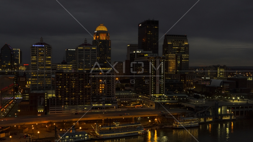 A view of hotel and the city skyline at twilight beside the river, Downtown Louisville, Kentucky Aerial Stock Photo DXP001_096_0016 | Axiom Images