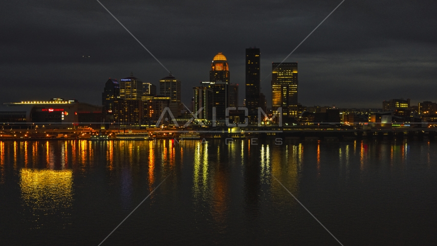 A view across the Ohio River toward the city skyline at twilight, Downtown Louisville, Kentucky Aerial Stock Photo DXP001_096_0018 | Axiom Images