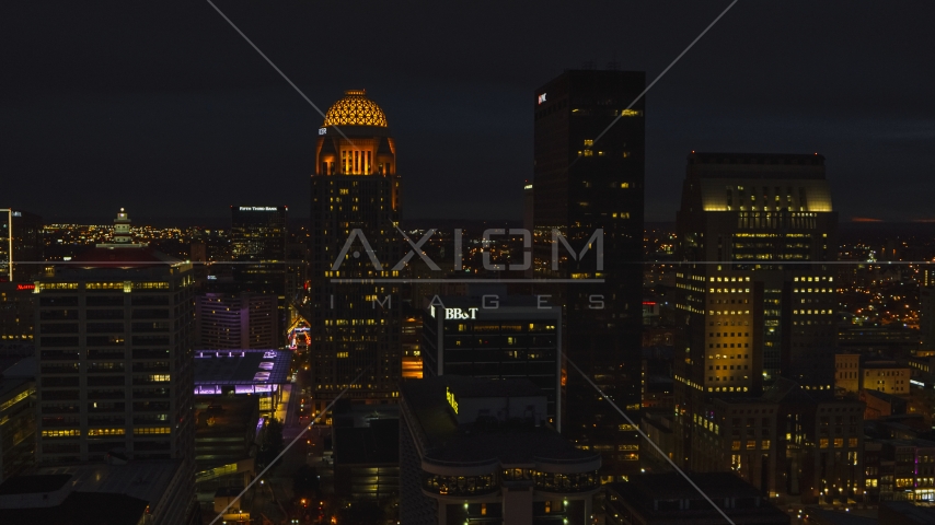 Towering skyscrapers lit up at twilight, Downtown Louisville, Kentucky Aerial Stock Photo DXP001_096_0023 | Axiom Images