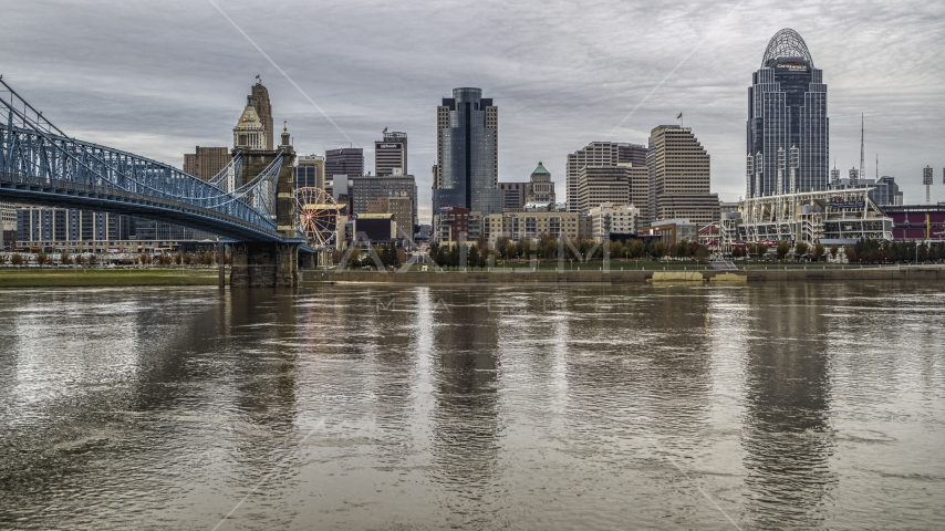 A view across the river by bridge focusing on city skyline, Downtown Cincinnati, Ohio Aerial Stock Photo DXP001_097_0008 | Axiom Images