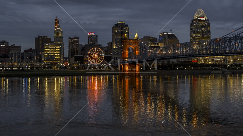 The city skyline across the Ohio River at twilight, Downtown Cincinnati, Ohio Aerial Stock Photo DXP001_098_0011 | Axiom Images