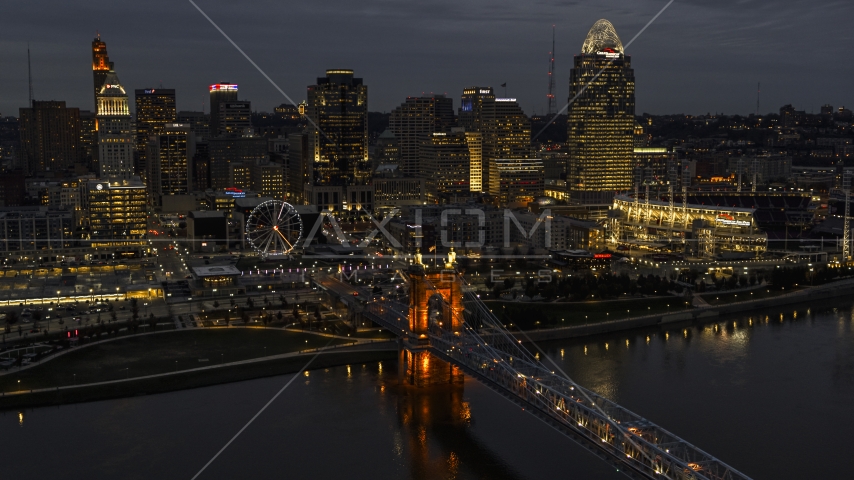 The city skyline at twilight, seen from river near bridge, Downtown Cincinnati, Ohio Aerial Stock Photo DXP001_098_0013 | Axiom Images