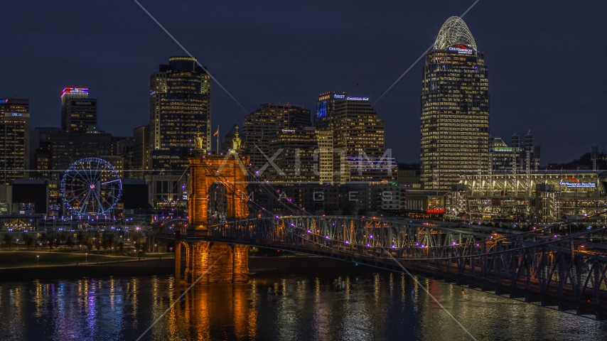 The Roebling Bridge at night and the city skyline, Downtown Cincinnati, Ohio Aerial Stock Photo DXP001_098_0017 | Axiom Images