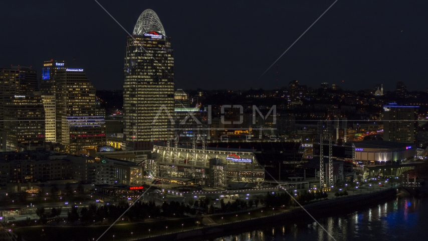 Tall skyscraper and the baseball stadium at night, Downtown Cincinnati, Ohio Aerial Stock Photo DXP001_098_0021 | Axiom Images