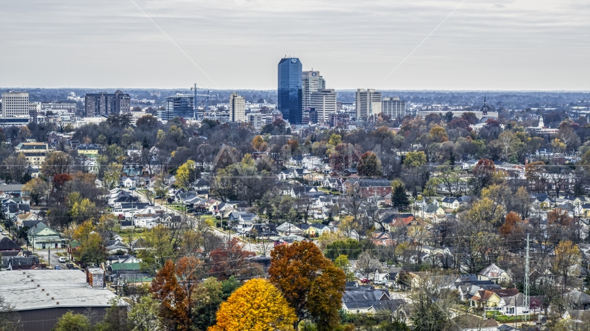 The city skyline while flying by tree-lined neighborhoods, Downtown Lexington, Kentucky Aerial Stock Photo DXP001_099_0012 | Axiom Images