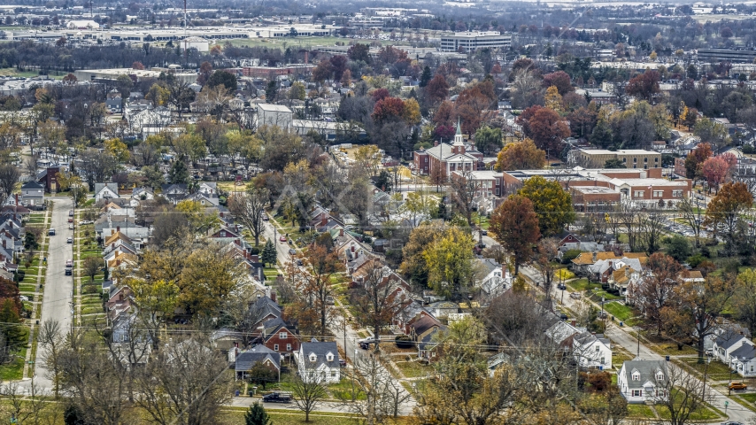 A church steeple and a tree-lined suburban neighborhood in Lexington, Kentucky Aerial Stock Photo DXP001_099_0015 | Axiom Images