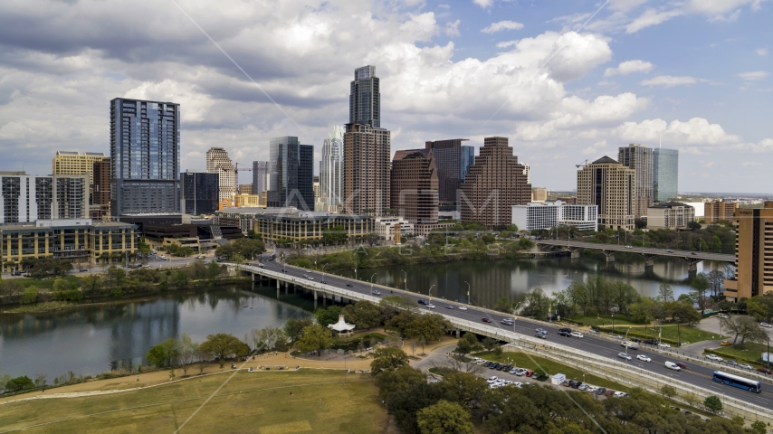 The First Street Bridge and Lady Bird Lake with view of skyline, Downtown Austin, Texas Aerial Stock Photo DXP002_102_0002 | Axiom Images
