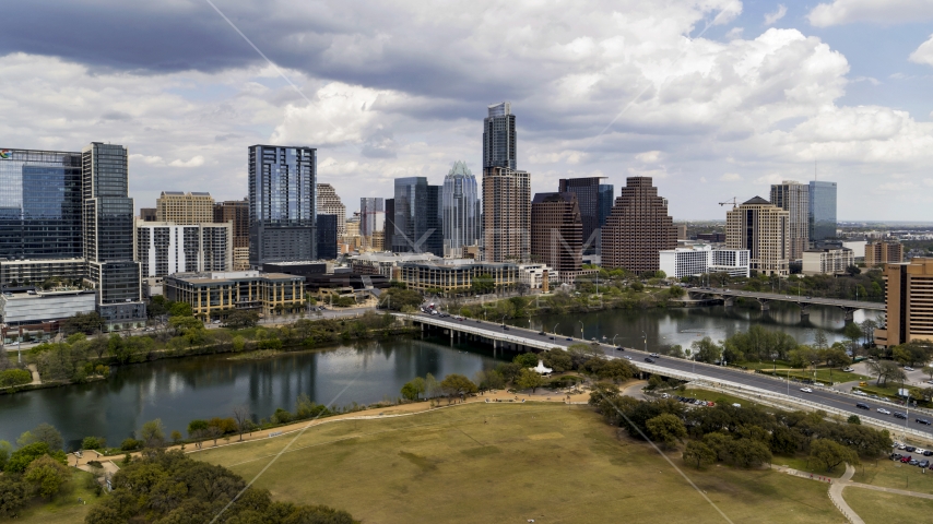 A view of the city's skyline from the First Street Bridge and Lady Bird Lake, Downtown Austin, Texas Aerial Stock Photo DXP002_102_0007 | Axiom Images