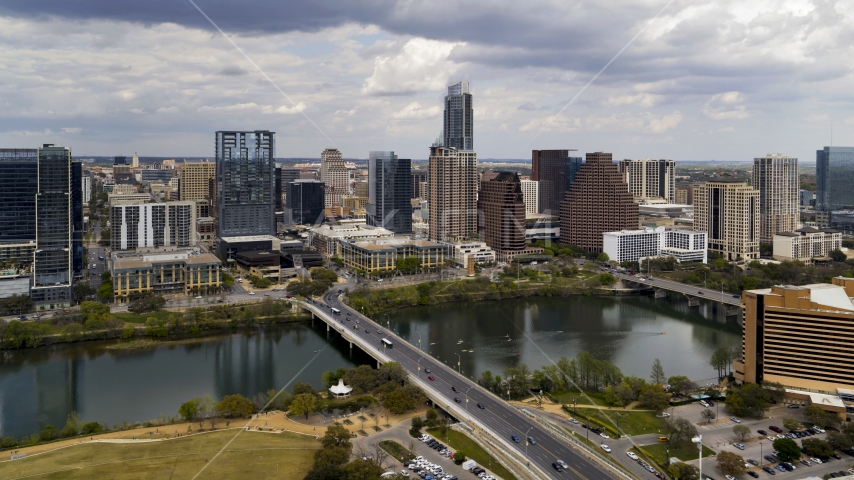 The city skyline seen from across Lady Bird Lake, Downtown Austin, Texas Aerial Stock Photo DXP002_102_0009 | Axiom Images