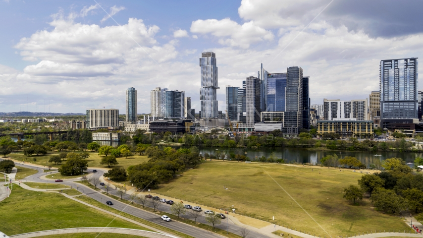 A view of city skyline across Lady Bird Lake in Downtown Austin, Texas Aerial Stock Photo DXP002_102_0015 | Axiom Images