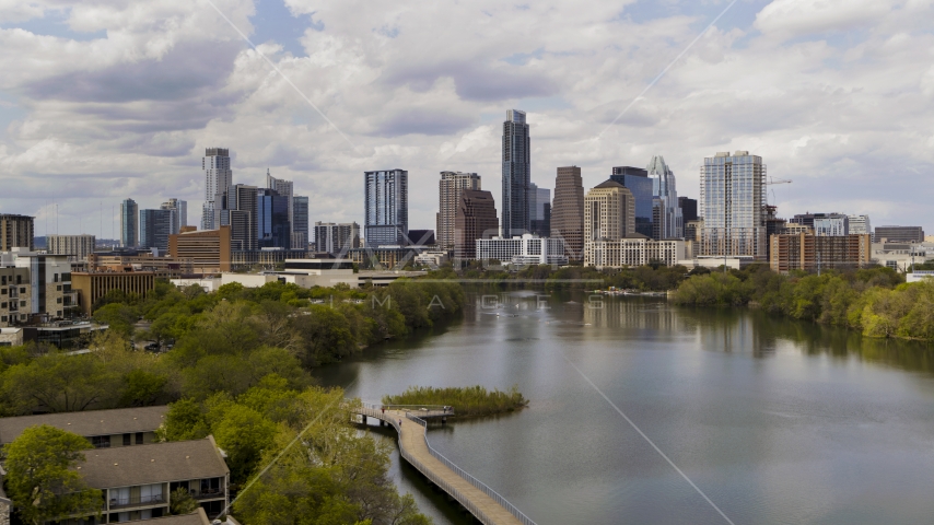A view of the city skyline from the shore of Lady Bird Lake, Downtown Austin, Texas Aerial Stock Photo DXP002_102_0016 | Axiom Images
