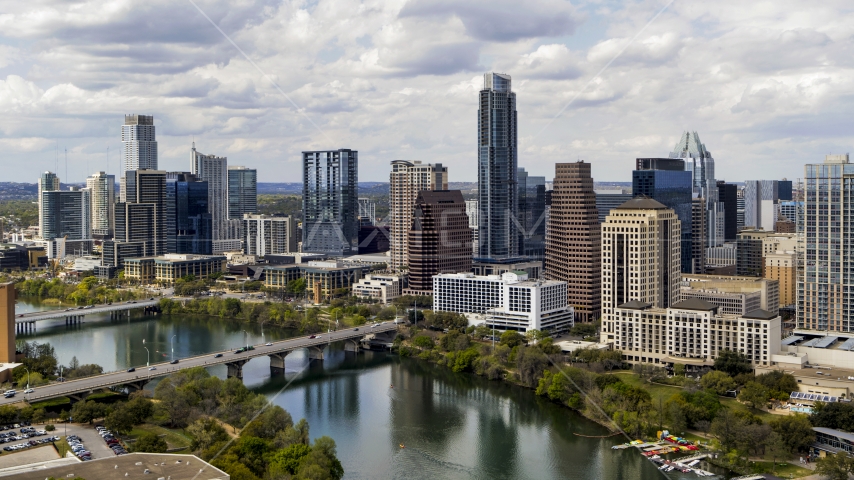 The city skyline beside bridges and Lady Bird Lake, Downtown Austin, Texas Aerial Stock Photo DXP002_102_0020 | Axiom Images