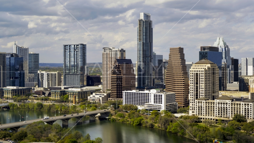 The Austonian and skyscrapers by Lady Bird Lake in Downtown Austin, Texas Aerial Stock Photo DXP002_103_0002 | Axiom Images