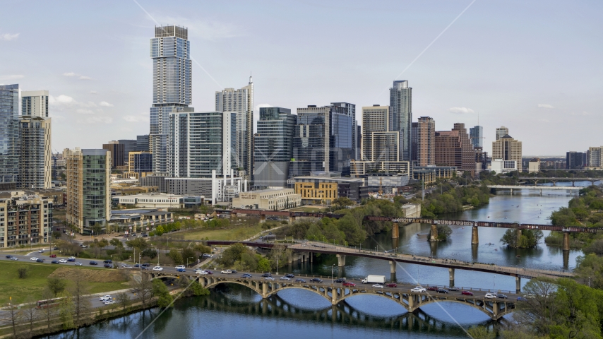 Waterfront skyscrapers by bridges spanning Lady Bird Lake, Downtown Austin, Texas Aerial Stock Photo DXP002_104_0004 | Axiom Images