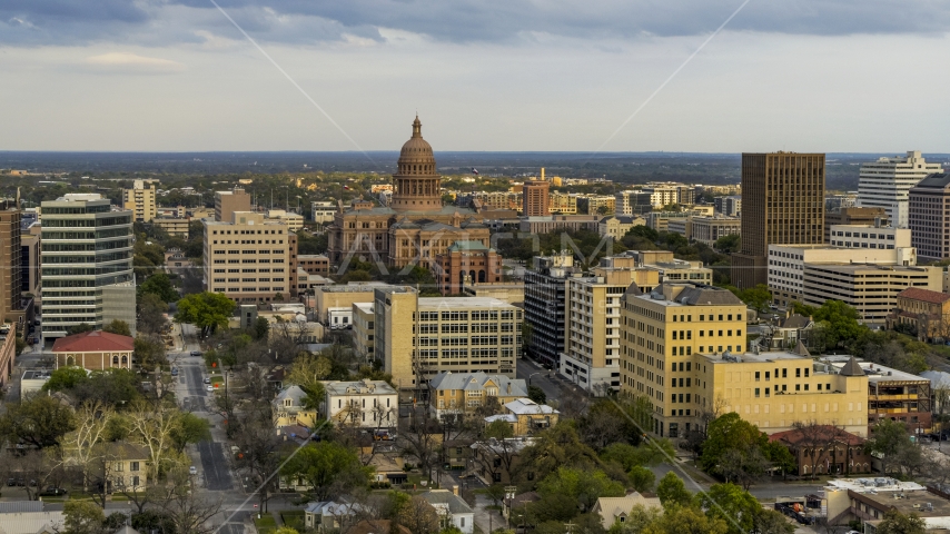 A view of the Texas State Capitol building at sunset in Downtown Austin, Texas Aerial Stock Photo DXP002_104_0012 | Axiom Images
