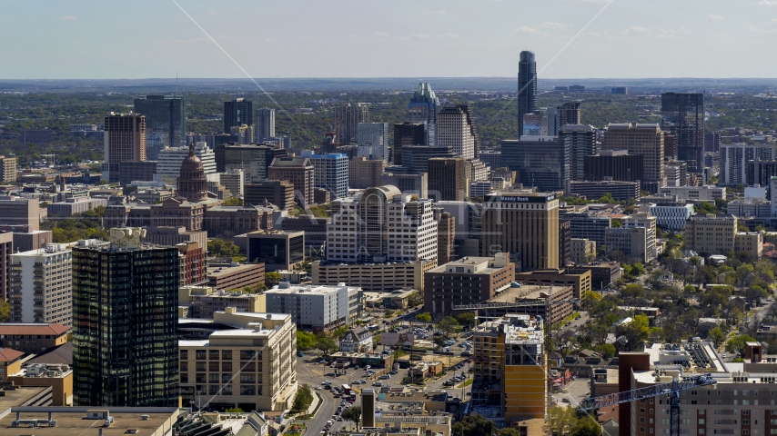 The capitol dome, office buildings and city skyline in Downtown Austin, Texas Aerial Stock Photo DXP002_108_0003 | Axiom Images