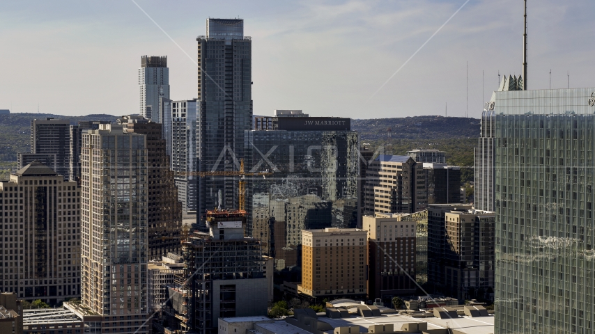 The Austonian skyscraper and high-rises in Downtown Austin, Texas Aerial Stock Photo DXP002_108_0007 | Axiom Images