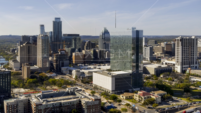 A hotel and the city's skyline in Downtown Austin, Texas Aerial Stock Photo DXP002_108_0016 | Axiom Images