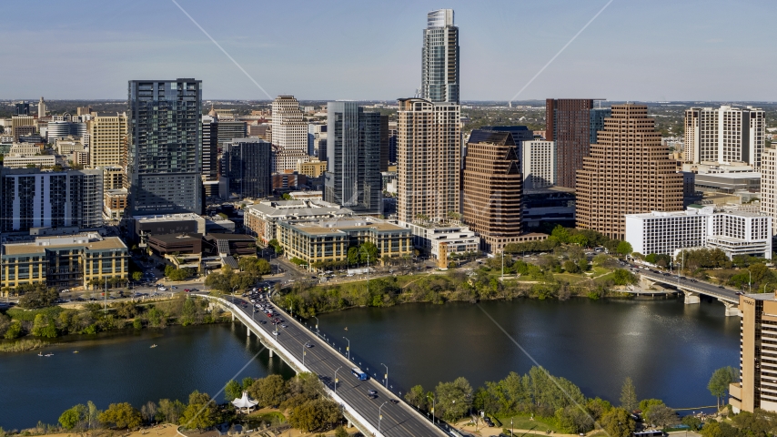 Skyscrapers in the city's skyline across Lady Bird Lake seen from a bridge in Downtown Austin, Texas Aerial Stock Photo DXP002_109_0006 | Axiom Images