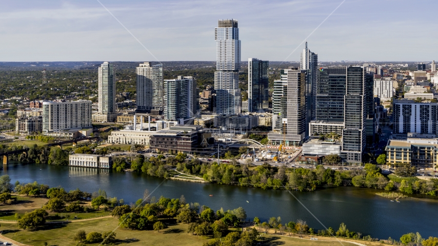 A modern skyscraper across Lady Bird Lake, Downtown Austin, Texas Aerial Stock Photo DXP002_109_0008 | Axiom Images