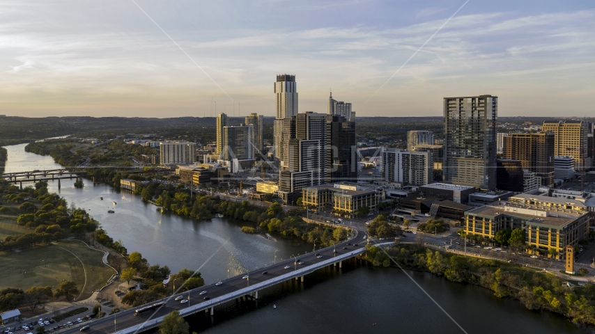 The city's waterfront skyline and Lady Bird Lake at sunset in Downtown Austin, Texas Aerial Stock Photo DXP002_110_0002 | Axiom Images