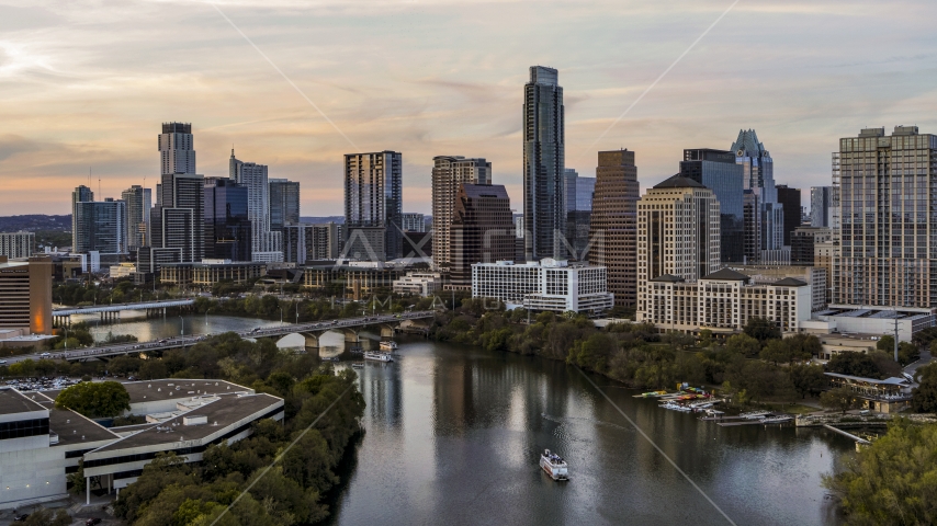 A view of Lady Bird Lake and the skyline at sunset in Downtown Austin, Texas Aerial Stock Photo DXP002_110_0005 | Axiom Images