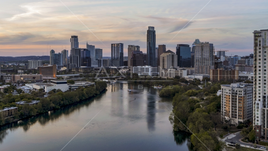 The waterfront skyline by Lady Bird Lake at sunset in Downtown Austin, Texas Aerial Stock Photo DXP002_110_0006 | Axiom Images