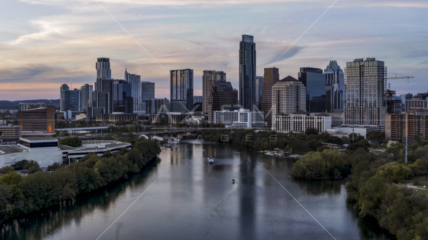 City skyline by Lady Bird Lake at twilight in Downtown Austin, Texas Aerial Stock Photo DXP002_110_0007 | Axiom Images