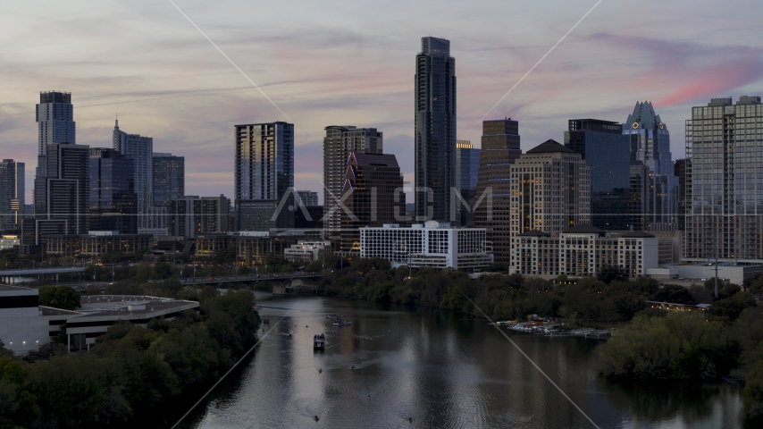 The skyline by Lady Bird Lake at twilight in Downtown Austin, Texas Aerial Stock Photo DXP002_110_0013 | Axiom Images