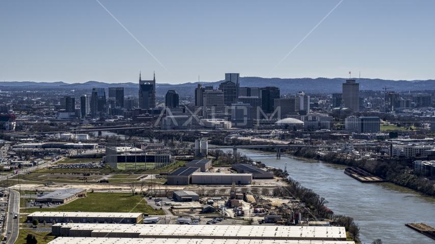 The city's skyline by the Cumberland River in Downtown Nashville, Tennessee Aerial Stock Photo DXP002_112_0006 | Axiom Images