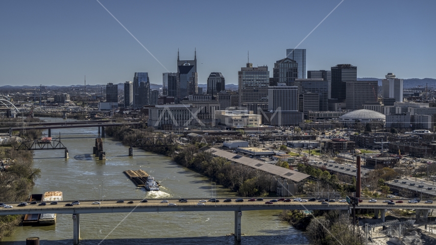 The city skyline seen from traffic on bridge over the river, Downtown Nashville, Tennessee Aerial Stock Photo DXP002_113_0002 | Axiom Images