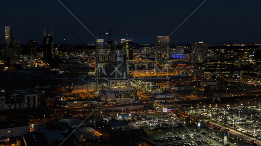 A high-rise building under construction at night, Downtown Nashville, Tennessee Aerial Stock Photo DXP002_115_0017 | Axiom Images