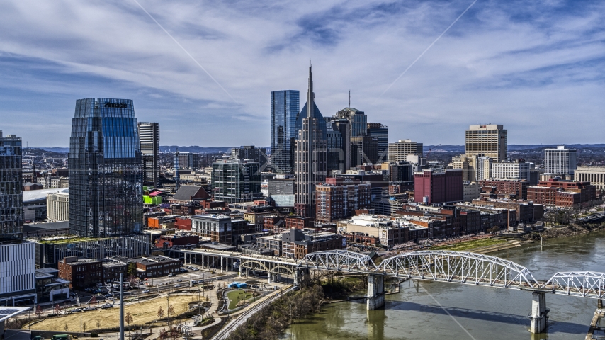 A view of the AT&T Building and a bridge over the river in Downtown Nashville, Tennessee Aerial Stock Photo DXP002_116_0002 | Axiom Images