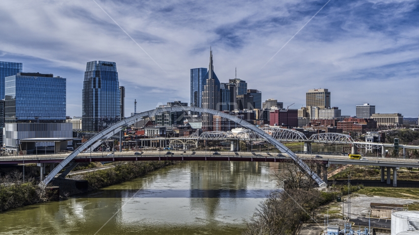 A view of bridge and skyscrapers in Downtown Nashville, Tennessee Aerial Stock Photo DXP002_116_0003 | Axiom Images