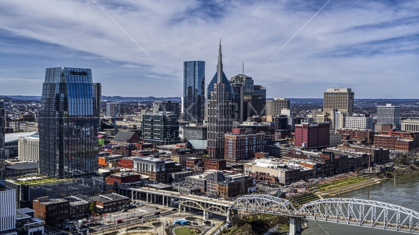 A view of tall city skyscrapers in Downtown Nashville, Tennessee Aerial Stock Photo DXP002_116_0007 | Axiom Images