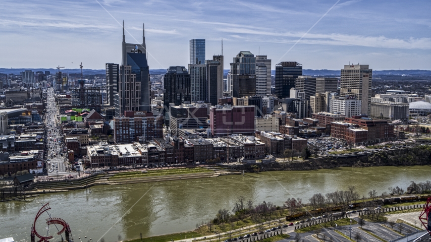 A view of city's skyline across the Cumberland River, Downtown Nashville, Tennessee Aerial Stock Photo DXP002_117_0006 | Axiom Images