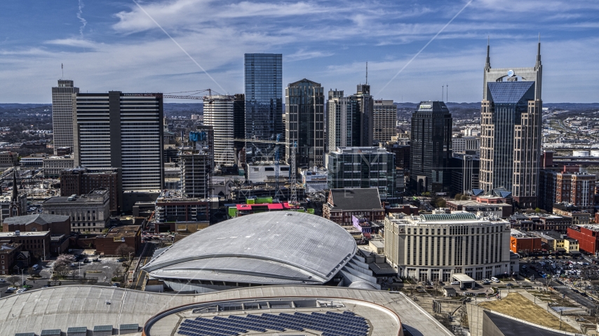 The city's skyline behind the arena, Downtown Nashville, Tennessee Aerial Stock Photo DXP002_117_0009 | Axiom Images