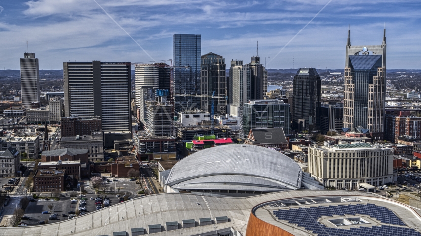 A view of the city's skyline behind the arena, Downtown Nashville, Tennessee Aerial Stock Photo DXP002_117_0010 | Axiom Images