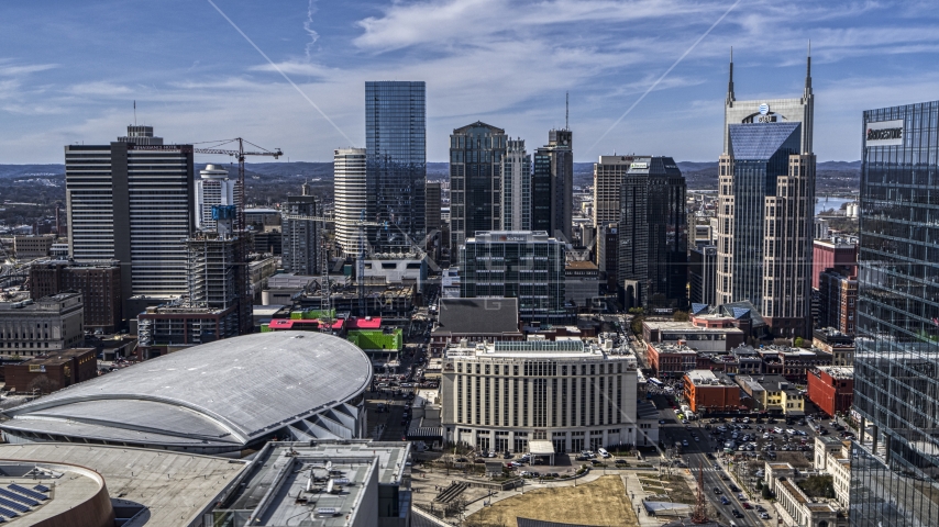 The city's skyline behind arena and hotel, Downtown Nashville, Tennessee Aerial Stock Photo DXP002_117_0011 | Axiom Images