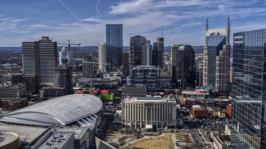 City's skyline behind the arena and hotel, Downtown Nashville, Tennessee Aerial Stock Photo DXP002_117_0012 | Axiom Images