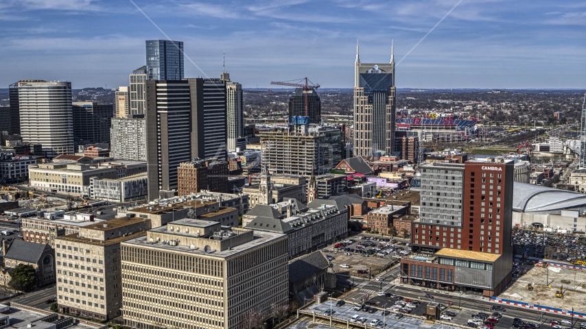 A high-rise hotel and skyscrapers in Downtown Nashville, Tennessee Aerial Stock Photo DXP002_118_0001 | Axiom Images