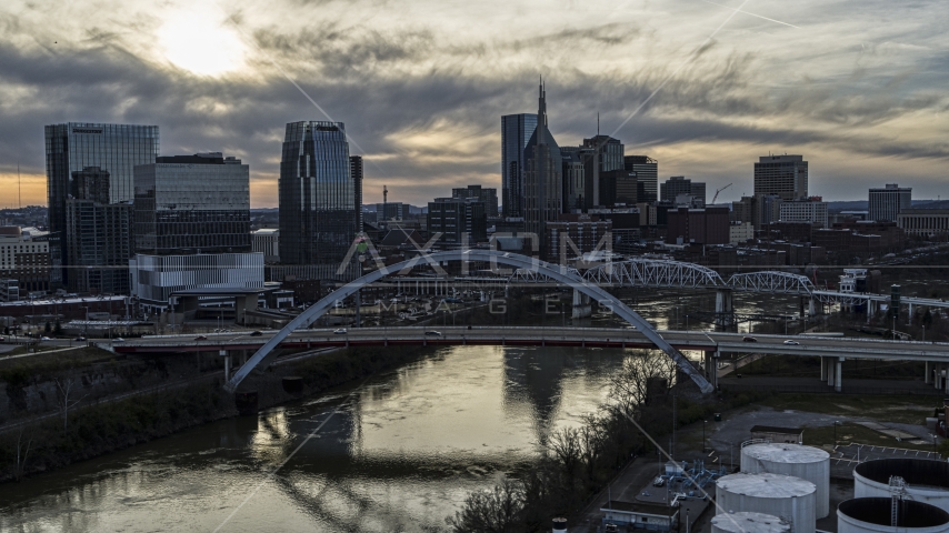 The city's skyline and bridges over the Cumberland River at sunset, Downtown Nashville, Tennessee Aerial Stock Photo DXP002_119_0007 | Axiom Images