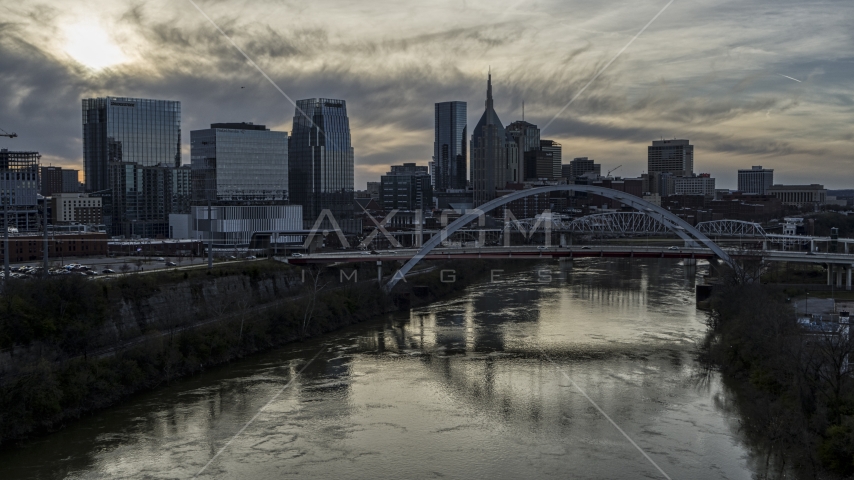 City skyline, bridges spanning the Cumberland River at sunset, Downtown Nashville, Tennessee Aerial Stock Photo DXP002_119_0012 | Axiom Images
