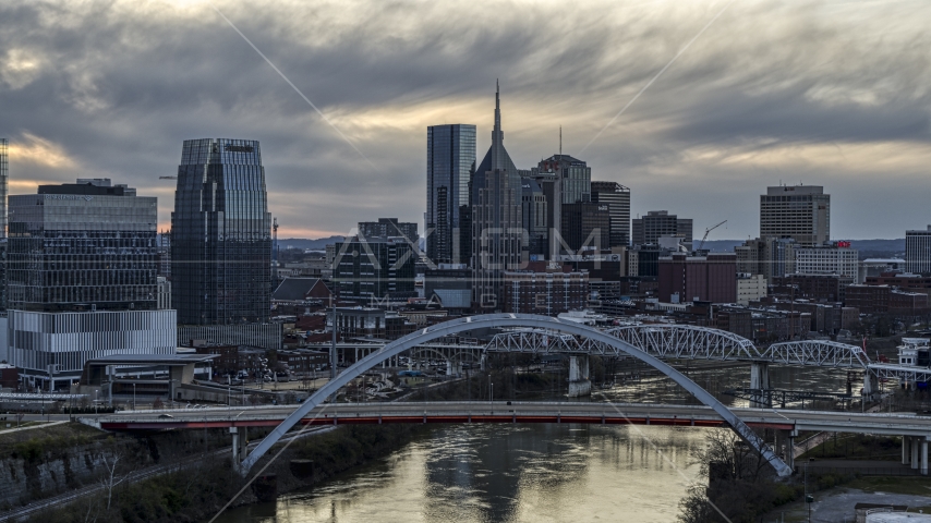 The downtown skyline seen from bridge on Cumberland River at sunset, Downtown Nashville, Tennessee Aerial Stock Photo DXP002_120_0001 | Axiom Images