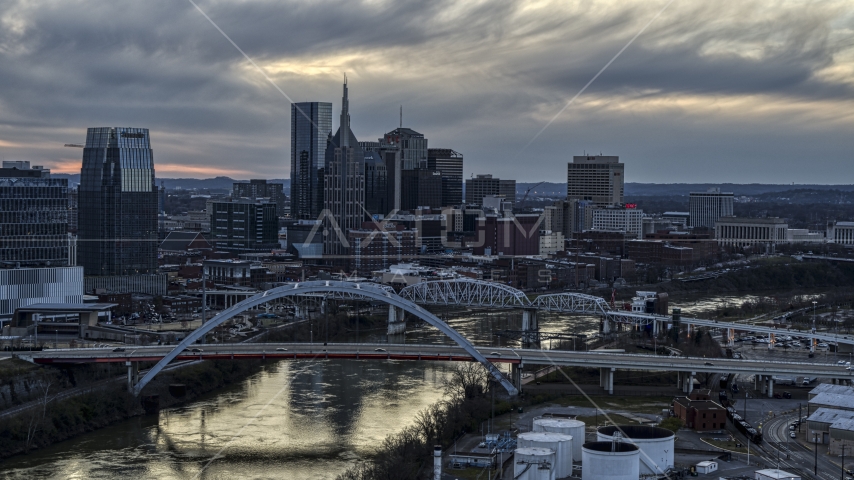 The riverfront skyline, two bridges, and the Cumberland River at sunset, Downtown Nashville, Tennessee Aerial Stock Photo DXP002_120_0007 | Axiom Images