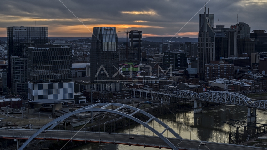 The Pinnacle skyscraper and a bridges on the river at sunset, Downtown Nashville, Tennessee Aerial Stock Photo DXP002_120_0010 | Axiom Images
