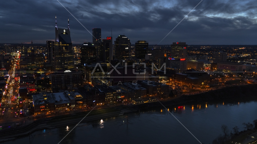 A view across the river toward the city's skyline at twilight, Downtown Nashville, Tennessee Aerial Stock Photo DXP002_121_0004 | Axiom Images