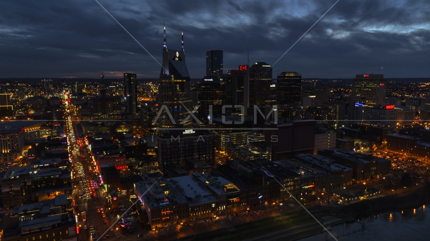 The AT&T Building skyscraper and city skyline at twilight, Downtown Nashville, Tennessee Aerial Stock Photo DXP002_121_0005 | Axiom Images